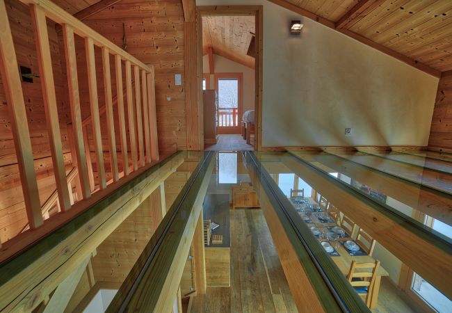 Glass landing chalet les Houches Impressive glass landing leading to double bedroom