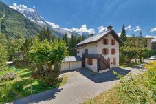 Exterior of apartment building and surrounding mountain views